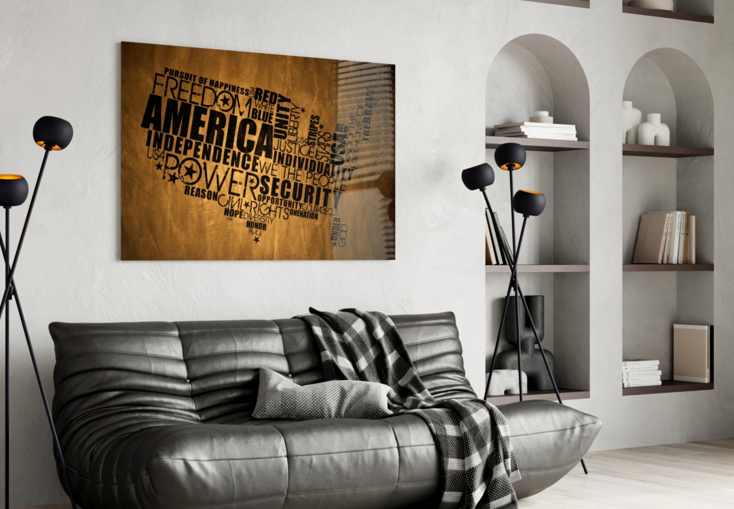 USA map glass wall art with black text on brown wood background displayed above gray leather sofa in modern living room.