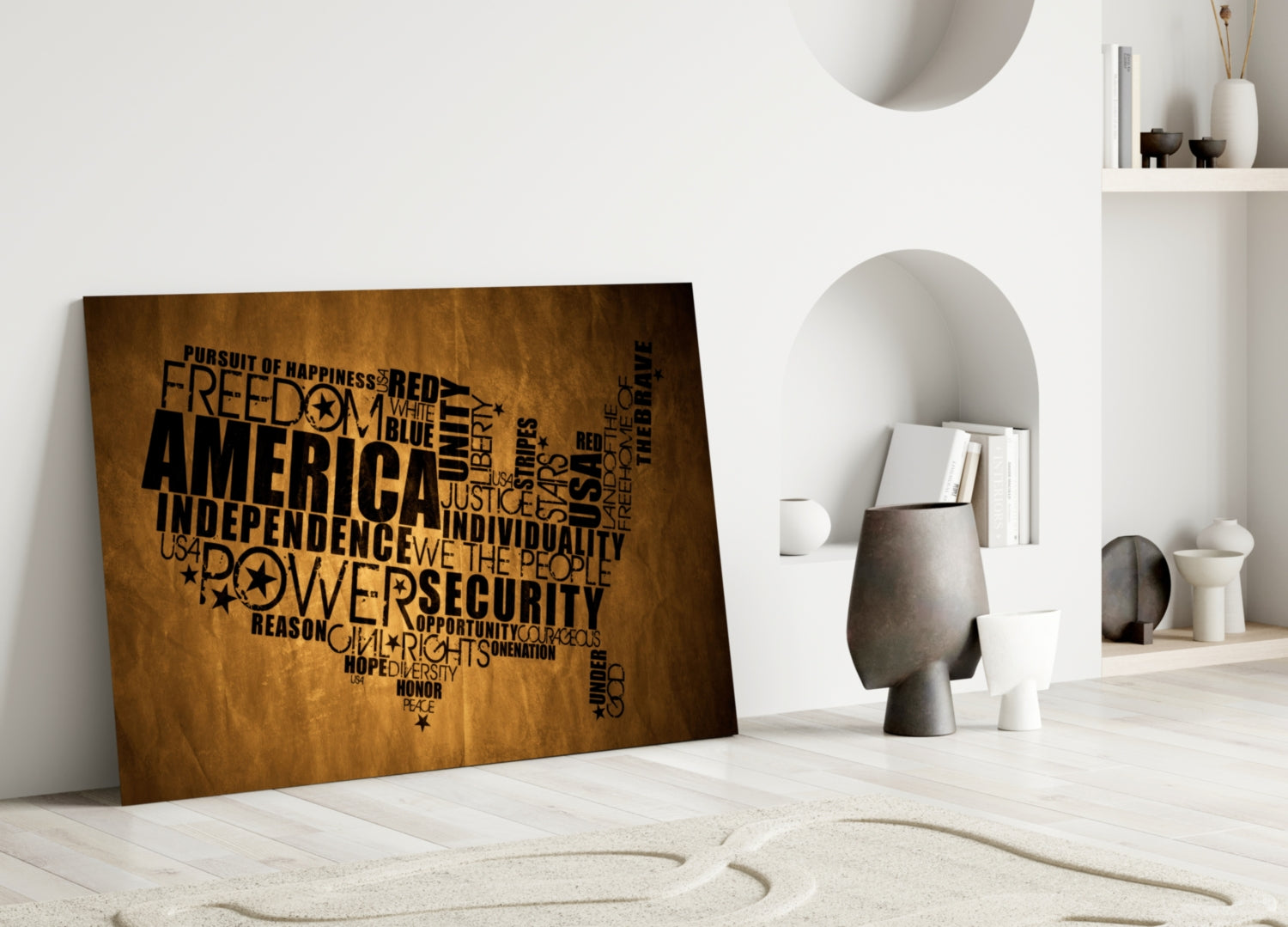 USA map glass wall art in bronze with black text displaying American values, leaning against white wall in minimalist interior.