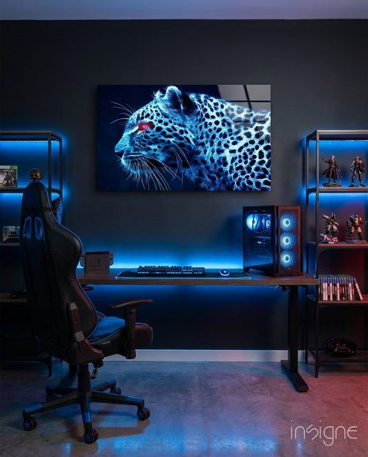 Neon blue leopard head glass artwork displayed on dark wall above gaming desk with RGB lighting in room setting.