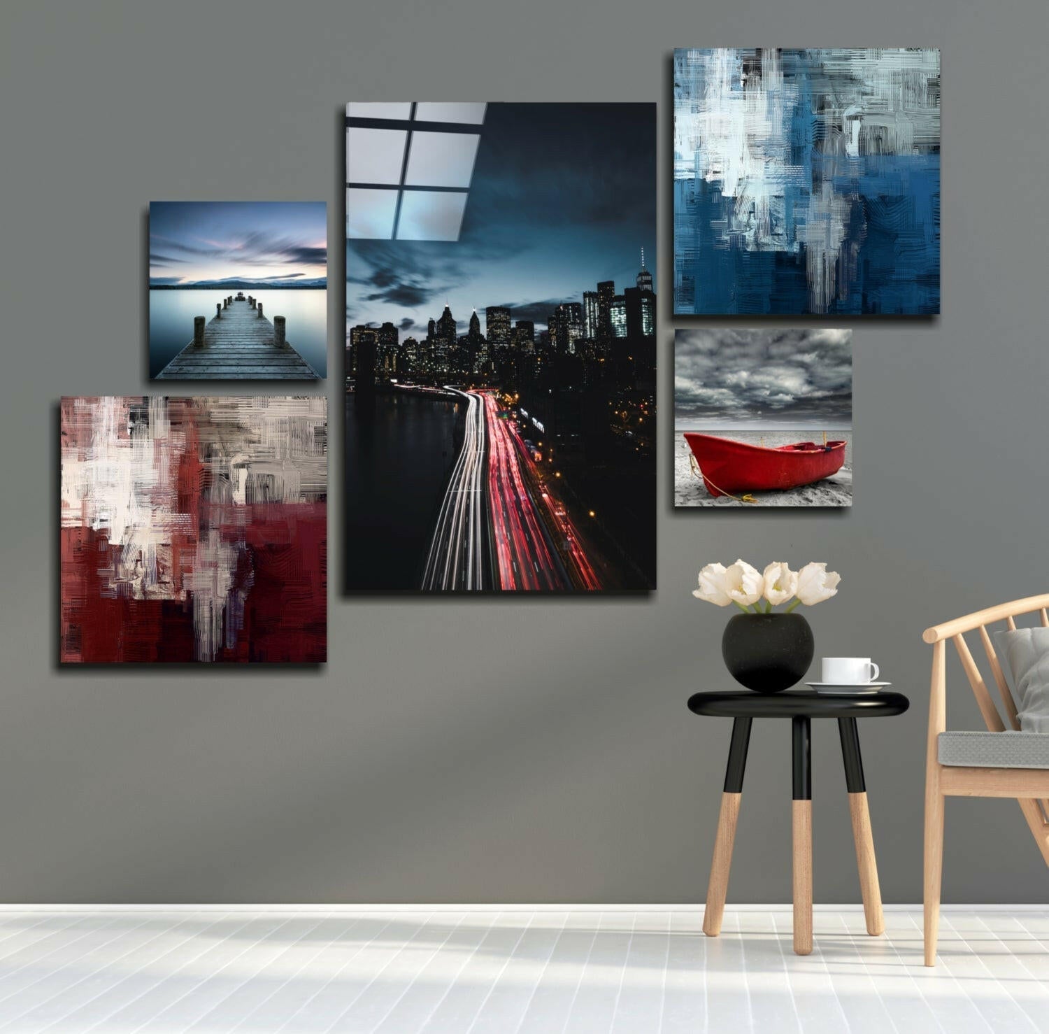 Blue Serenity Combined Glass Wall Art displayed on gray wall above wooden chair with black side table and white flowers.