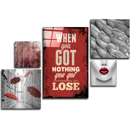 Five glass wall art panels arranged in a collage featuring red and black grunge textures, motivational text, umbrellas, feathers, and red lips.