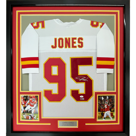 Framed white Kansas City Chiefs jersey number 95 with "JONES" nameplate, signed, displayed with red and gold matting and two action photos.