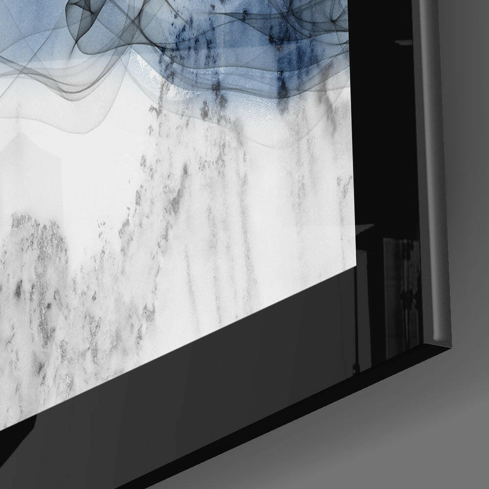Close-up angled view of Blue Nebula Glass Wall Art mounted on white wall, showing blue and white nebula design with dark frame edge.