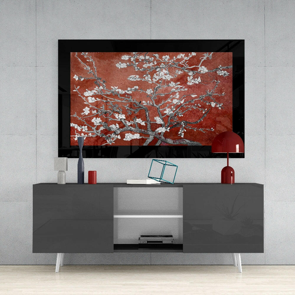 Maroon Almond Flowers glass art displayed on wall above gray media console with white shelving and red decorative accessories.