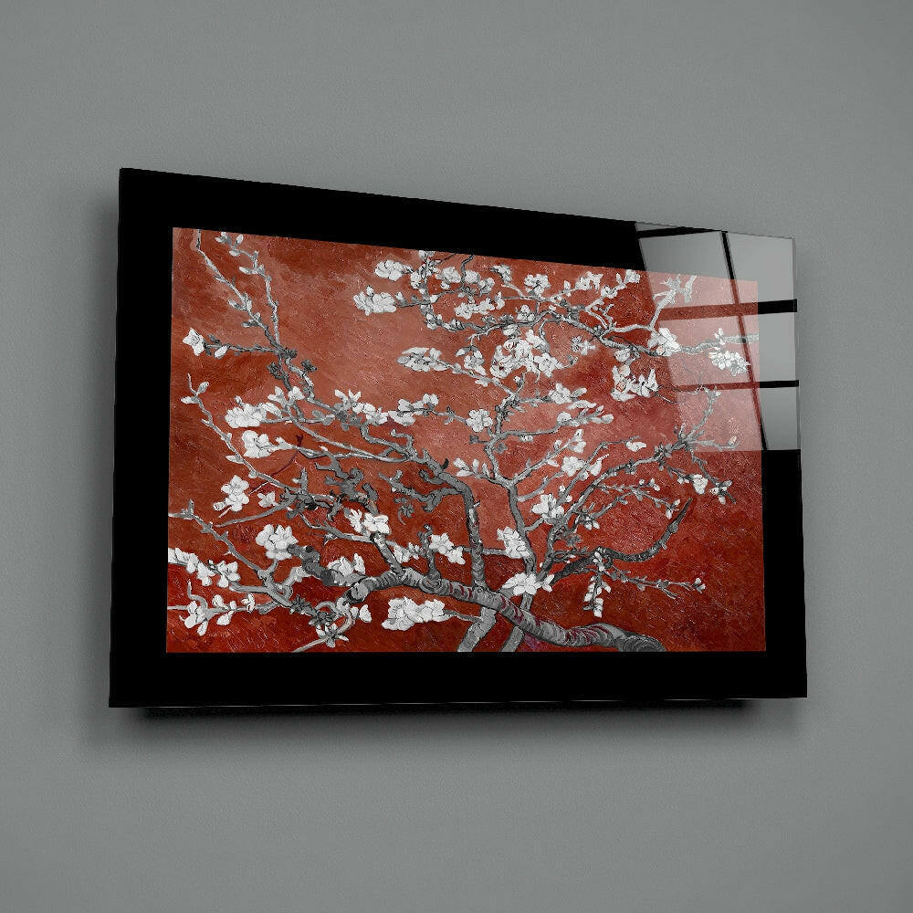 Maroon Almond Flowers Glass Wall Art mounted on gray wall, angled view showing black frame and translucent glass panel with red background and white floral design.