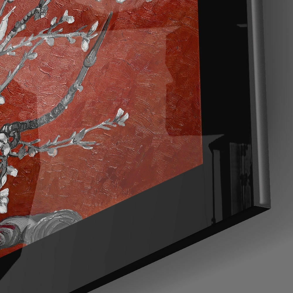 Close-up angled view of maroon glass wall art with silver-grey almond flower branches and decorative scrollwork details in black frame.