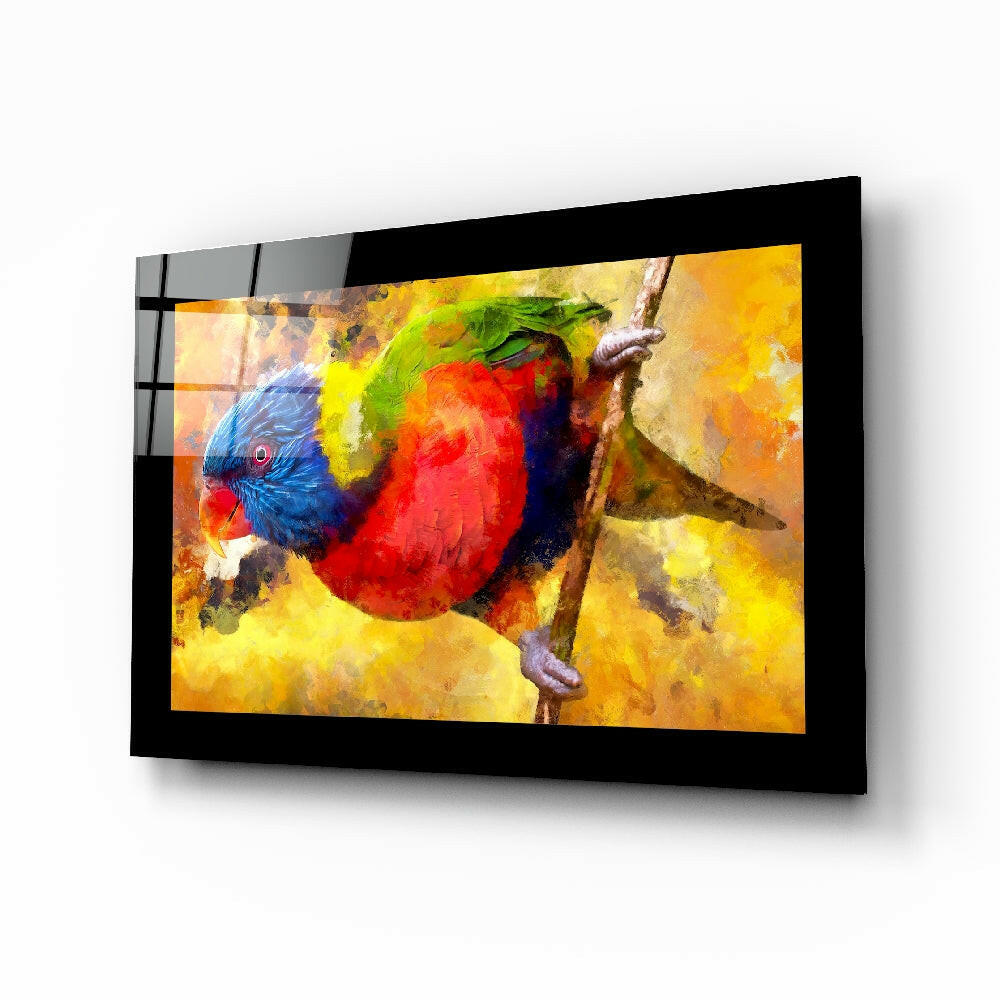 Black-framed glass wall art displaying a colorful parrot with red, yellow, and blue plumage on a warm golden background, mounted at an angle.