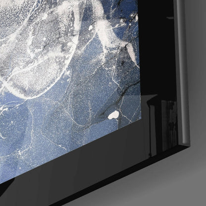 Blue Quartz Glass Wall Art displayed at an angle showing white and gray veining patterns on deep blue glass with black frame edge visible.