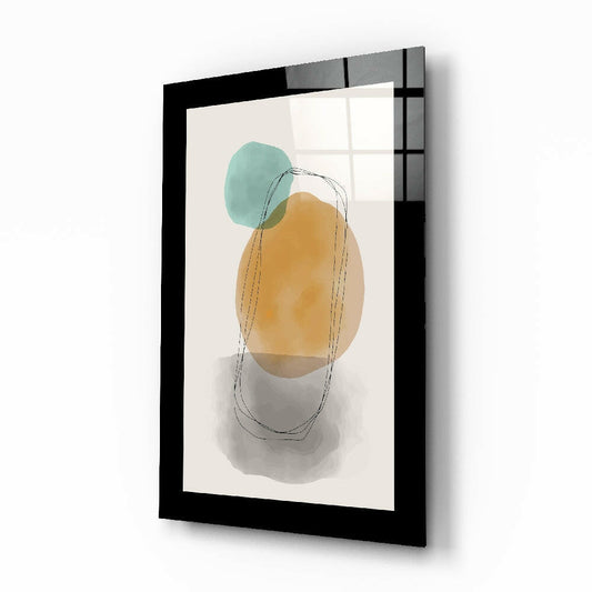 Black-framed glass wall art displaying abstract watercolor shapes in teal, ochre, and gray with sketch line overlay on cream background.