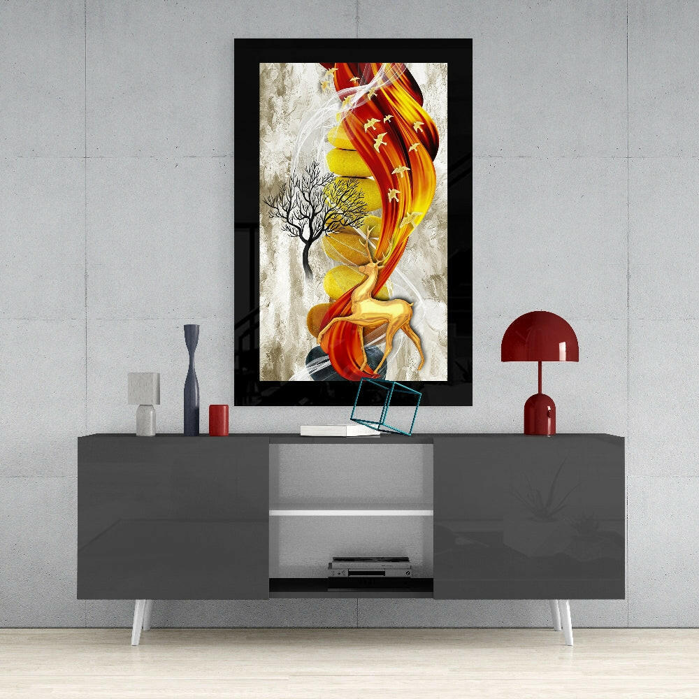 Framed red and gold glass deer art displayed above gray media console in modern living room setting.