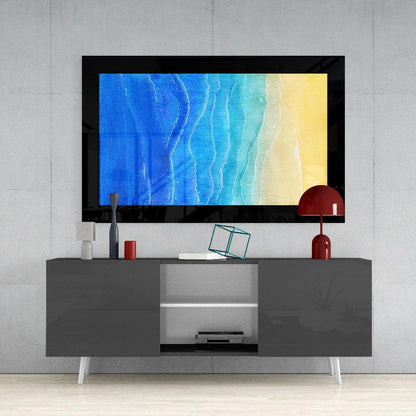Modern living room setup with framed beach gradient artwork displaying blue, turquoise, and yellow tones mounted above gray media console.