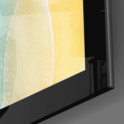 Close-up angle view of glass wall art featuring yellow and green watercolor gradient with white drip details and black frame edge.