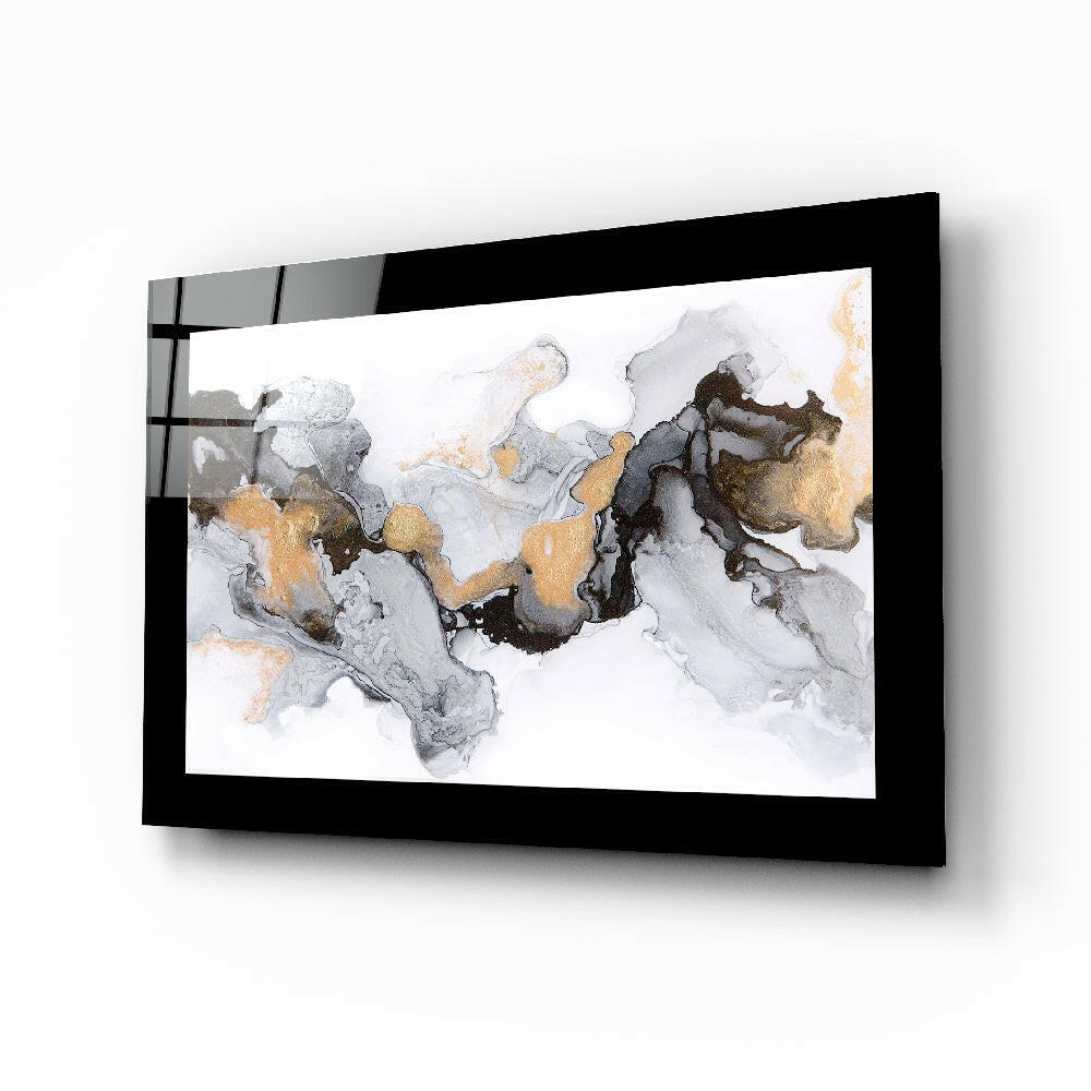 Black-framed glass wall art displaying abstract marble pattern with gray, white, and gold swirled design, mounted at angle.
