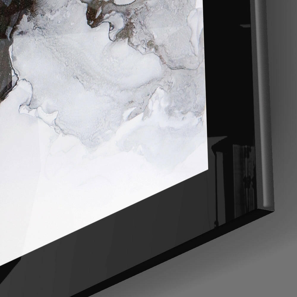 Angled side view of marble pattern glass wall art mounted on gray wall, showing black frame edge and white glass with gray veining detail.