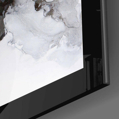 Angled side view of marble pattern glass wall art mounted on gray wall, showing black frame edge and white glass with gray veining detail.