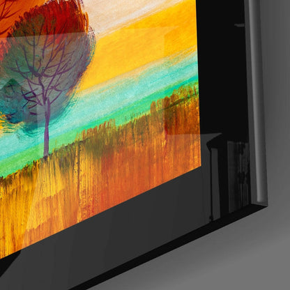 Angled perspective view of glass wall art displaying a stylized tree silhouette against vibrant horizontal bands of orange, yellow, turquoise, and green.
