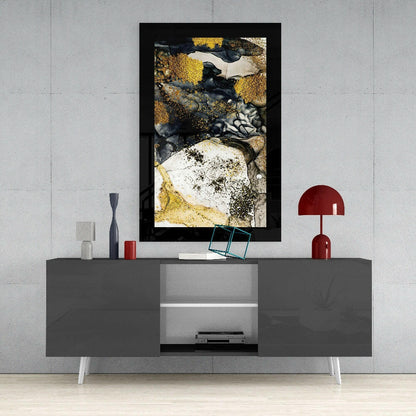 Black-framed abstract wall art with gold, white, and charcoal powder textures displayed above modern gray media console.