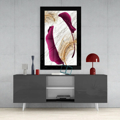 Modern living room interior with framed purple leaf glass art hanging above gray media console with red lamp and accessories.