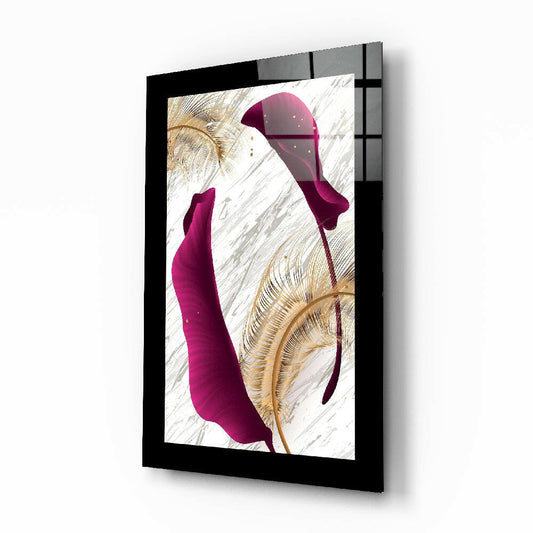 Angled perspective of framed glass wall art featuring burgundy abstract shapes and gold botanical elements on marble background with black frame.