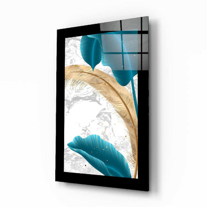 Three-dimensional angled view of framed glass wall art featuring turquoise fluid shapes and gold leaf accents against white background.