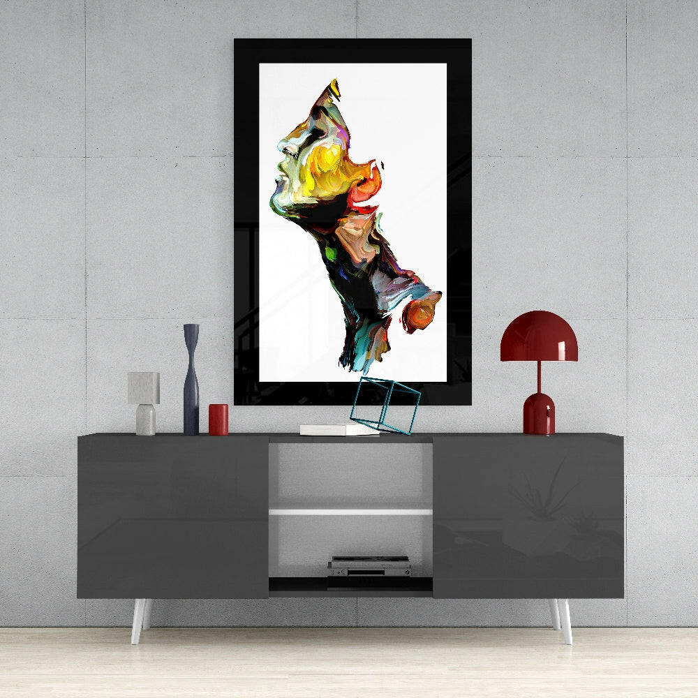Modern living room interior featuring a black-framed abstract glass wall art displaying vibrant multicolored sculptural forms above a gray media console.