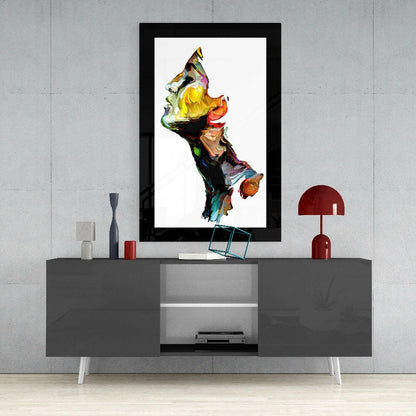 Modern living room interior featuring a black-framed abstract glass wall art displaying vibrant multicolored sculptural forms above a gray media console.