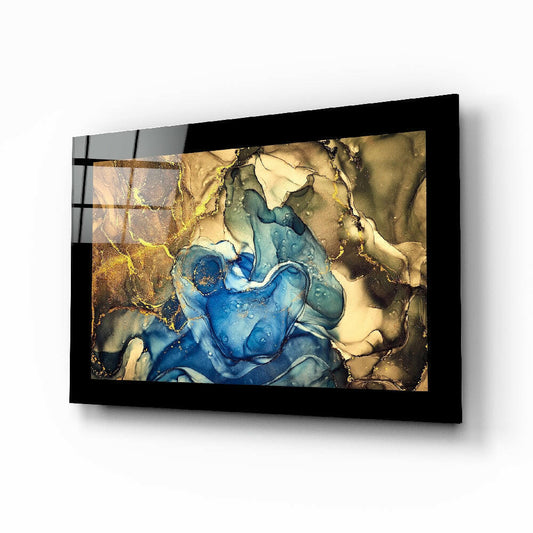 Black-framed glass wall art displaying abstract blue, gold, and cream fluid resin design mounted at angle.