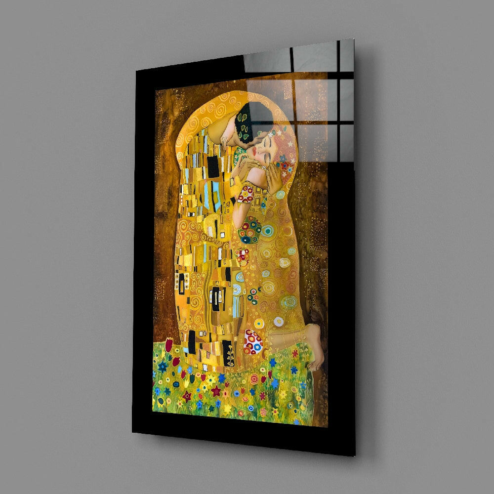 Black-framed glass panel displaying Klimt's "The Kiss" with gold, blue, and green tones, mounted at an angle against gray wall.