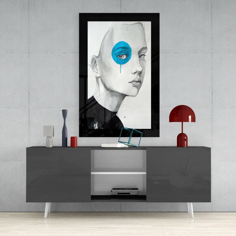 Blue VisionGlass framed wall art displayed above gray console table with red lamp and decorative accessories.