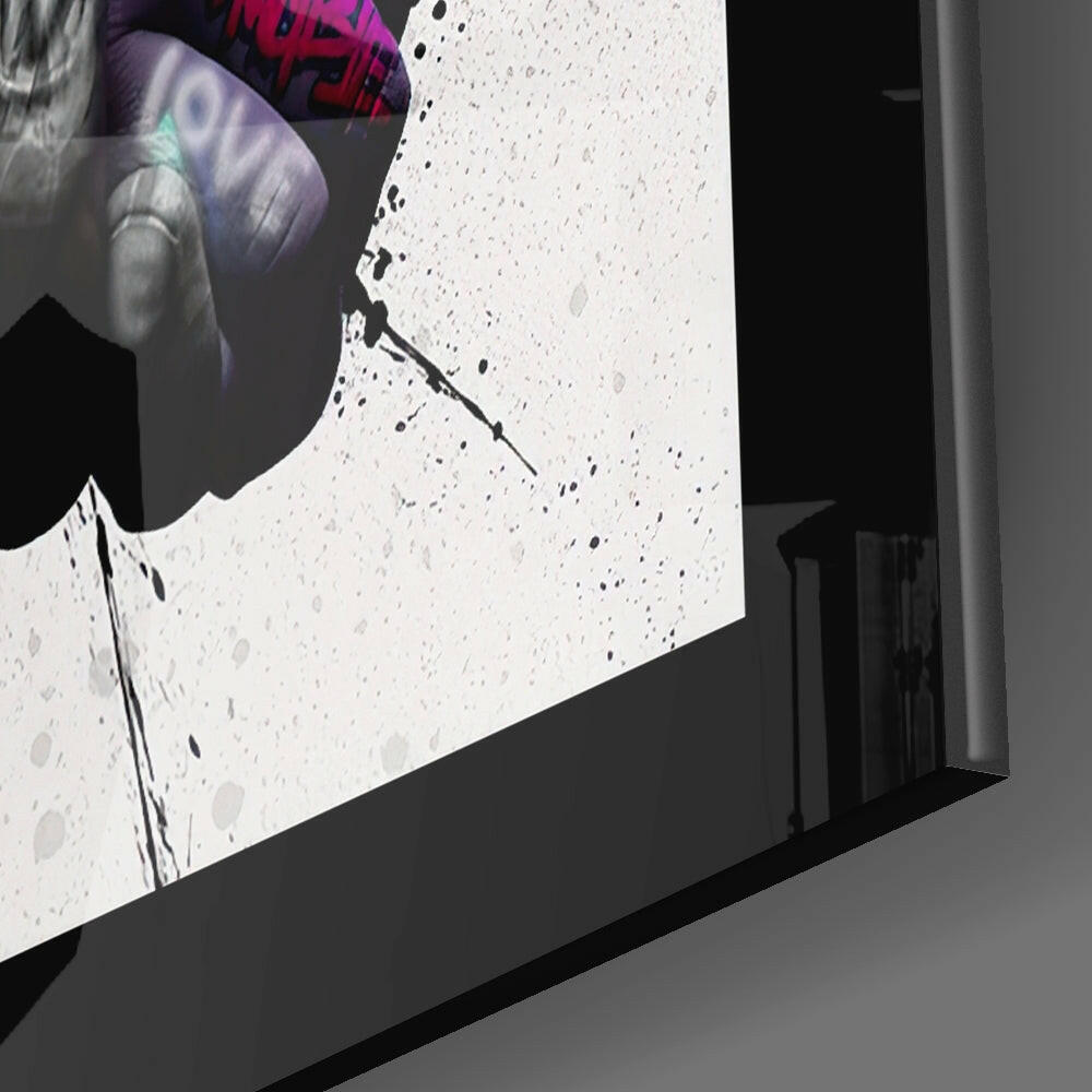 Close-up angled view of textured white glass surface with black speckles and purple text visible at top edge.