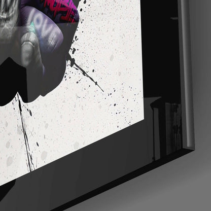 Close-up angled view of textured white glass surface with black speckles and purple text visible at top edge.