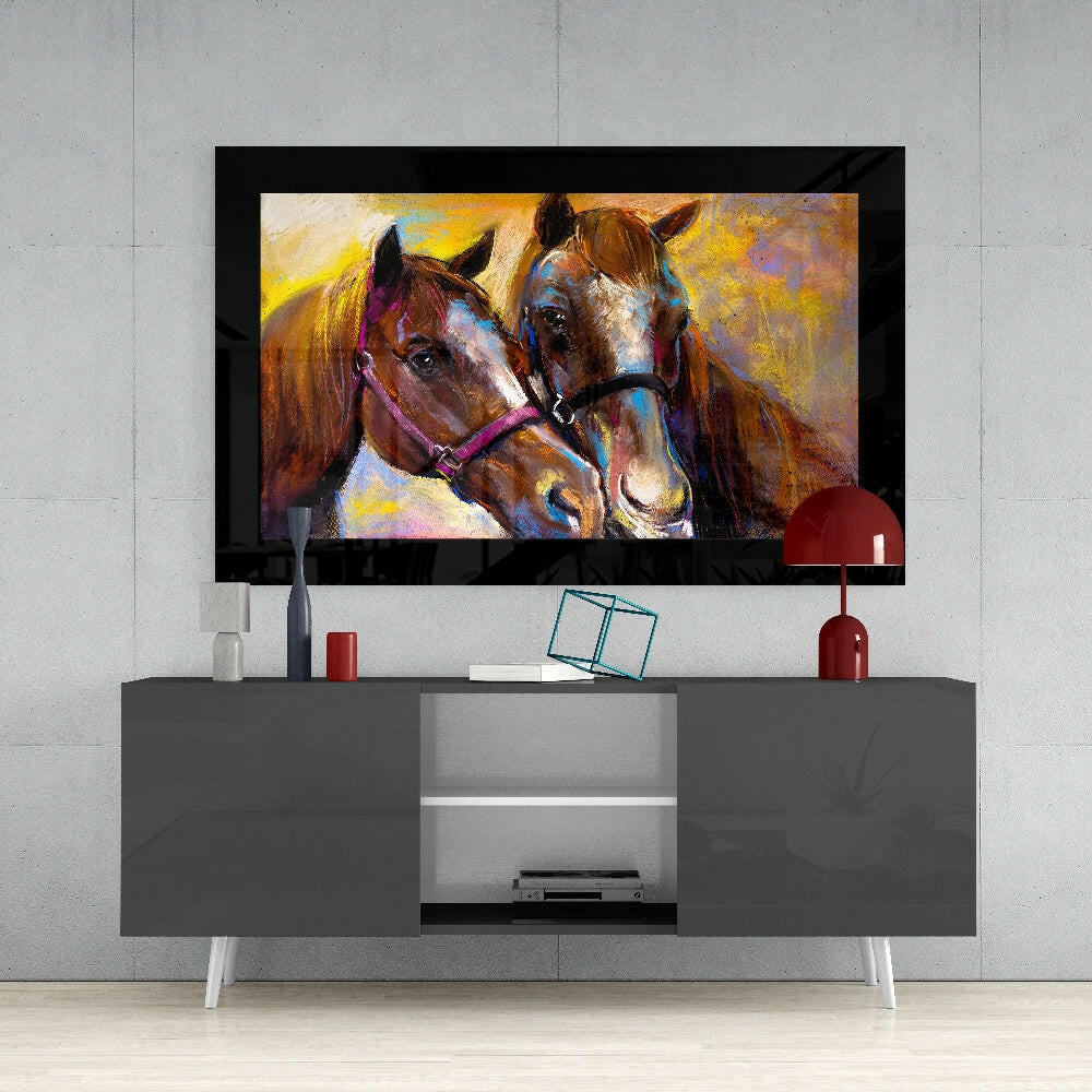 Colorful glass wall art of two horses displayed on a black-framed TV above a gray media console in a modern living room setting.
