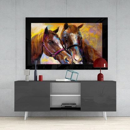 Colorful glass wall art of two horses displayed on a black-framed TV above a gray media console in a modern living room setting.