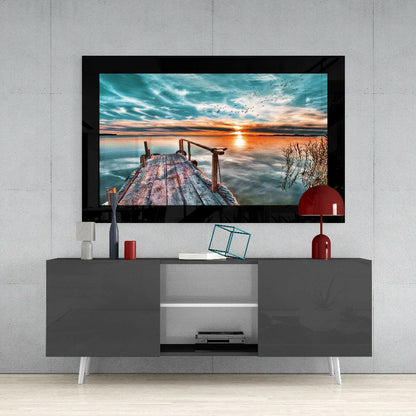 Weathered Dock With Bird Flock at Sunset Glass Wall Art
