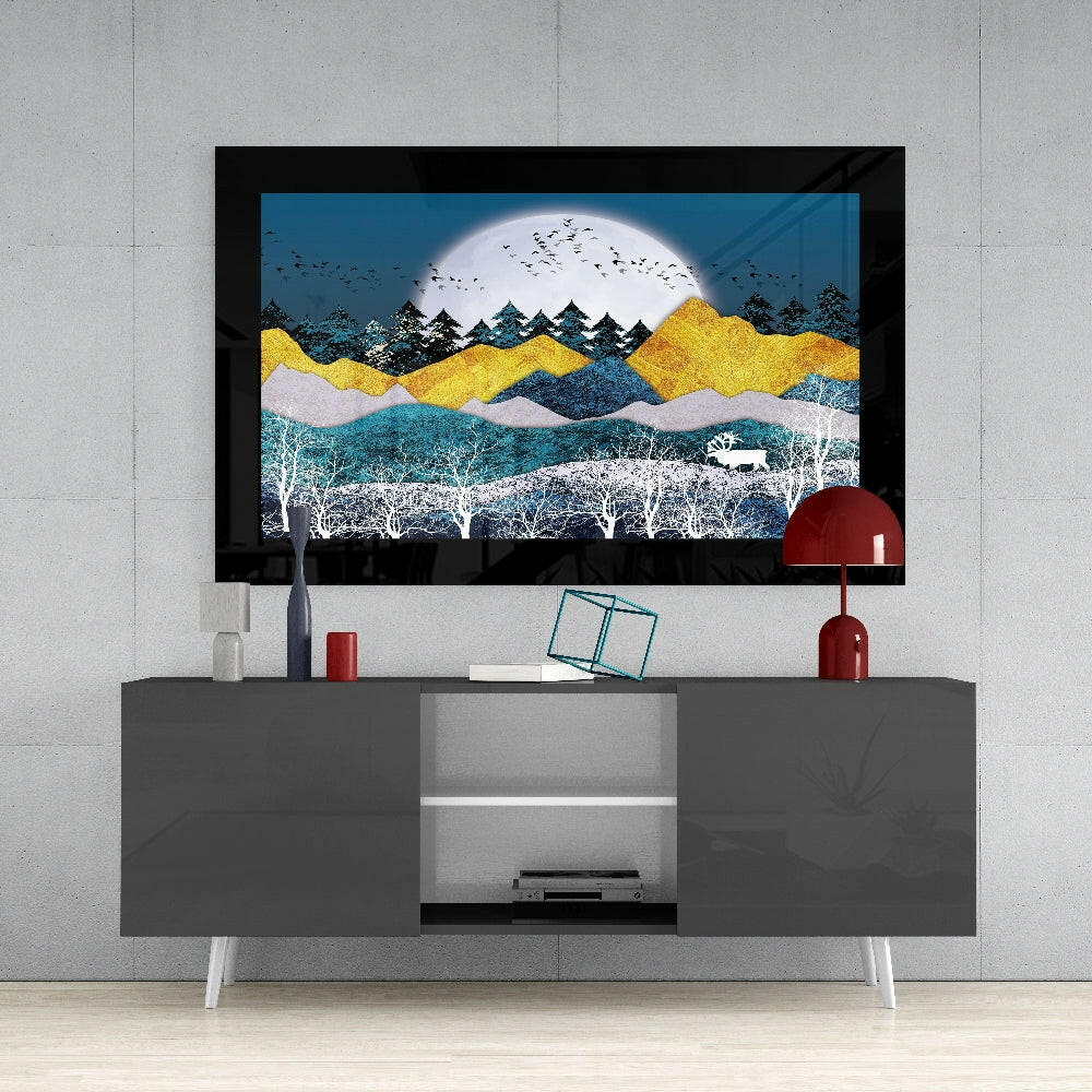 Golden Mountains Glass Wall Art displayed above a gray media console, featuring layered landscape with yellow peaks, white moon, and silhouetted trees.