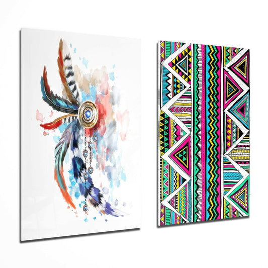 Two glass wall art panels displayed at an angle: left panel shows a watercolor dreamcatcher with colorful feathers and blue accents; right panel displays vibrant geometric tribal patterns in magenta, yellow, cyan, and black.