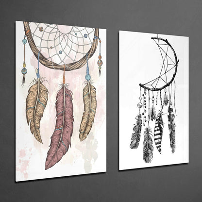 Two glass wall art panels displayed at an angle on gray wall: left panel shows colorful dreamcatcher with ornate feathers; right panel shows monochrome crescent moon dreamcatcher.