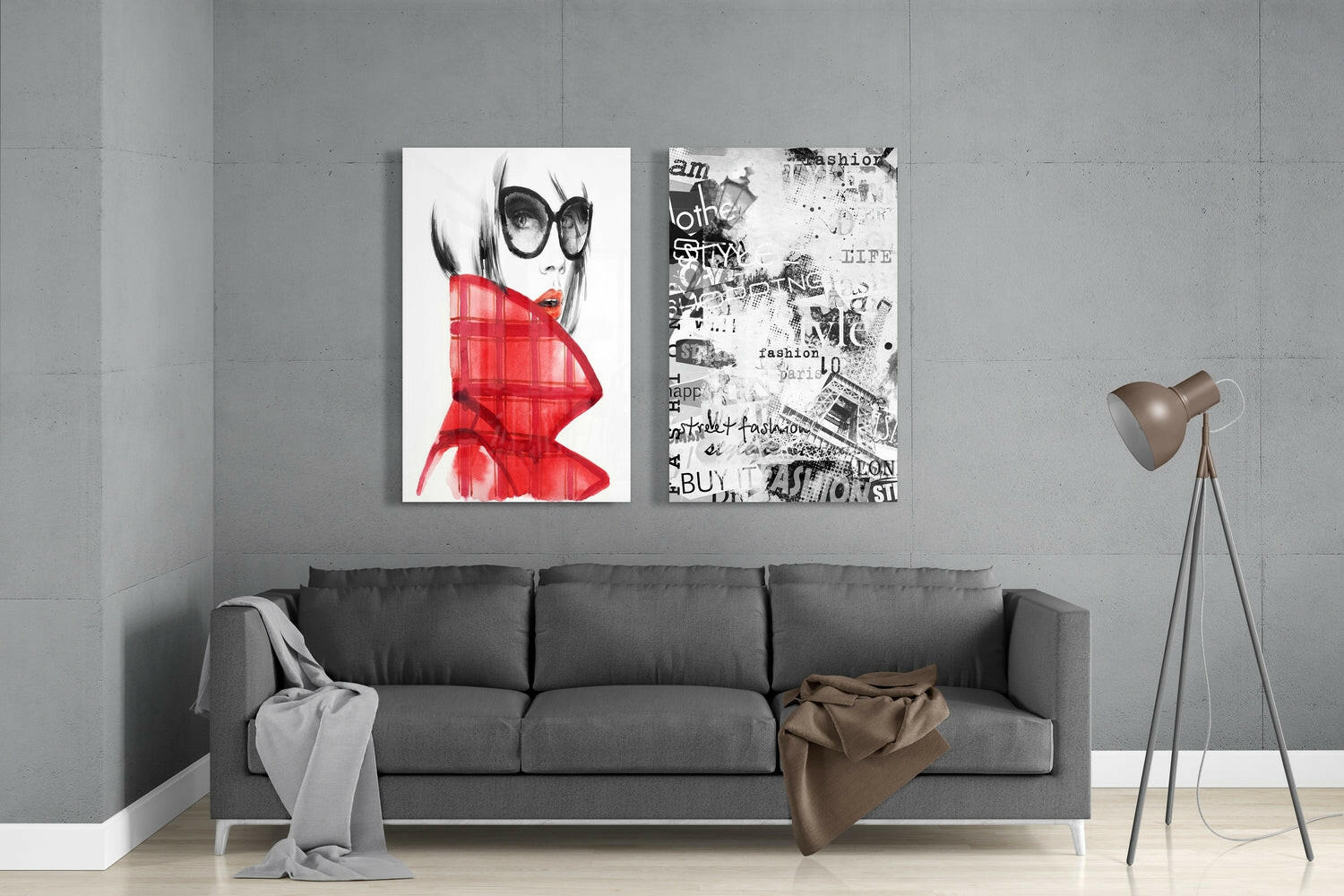 Two framed glass art prints hung above a gray sofa: left shows a woman with sunglasses and red jacket; right displays black and white fashion collage with text.