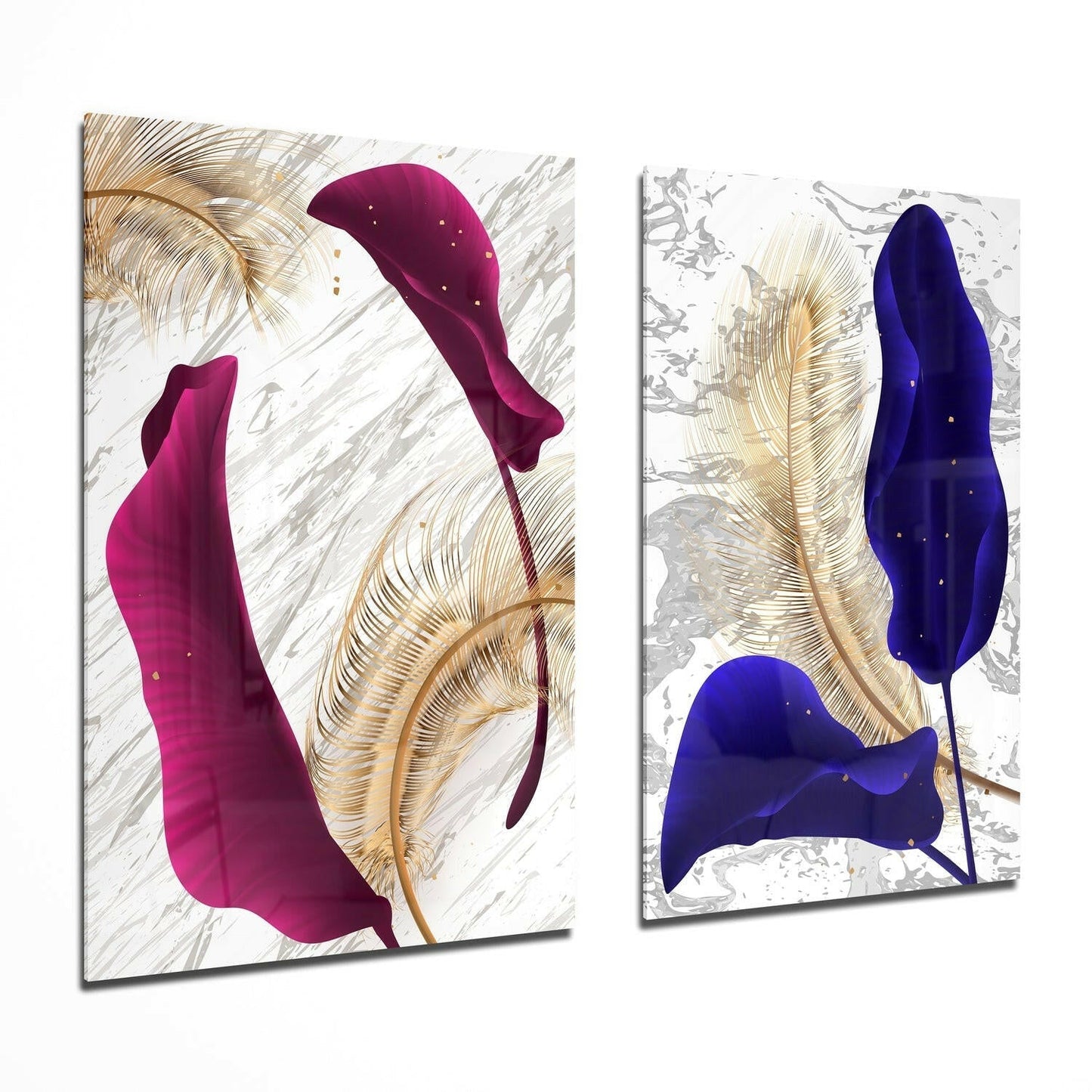 Two glass wall art panels displaying abstract flowing shapes in magenta and deep blue with golden feather designs on textured white backgrounds, shown at an angle.
