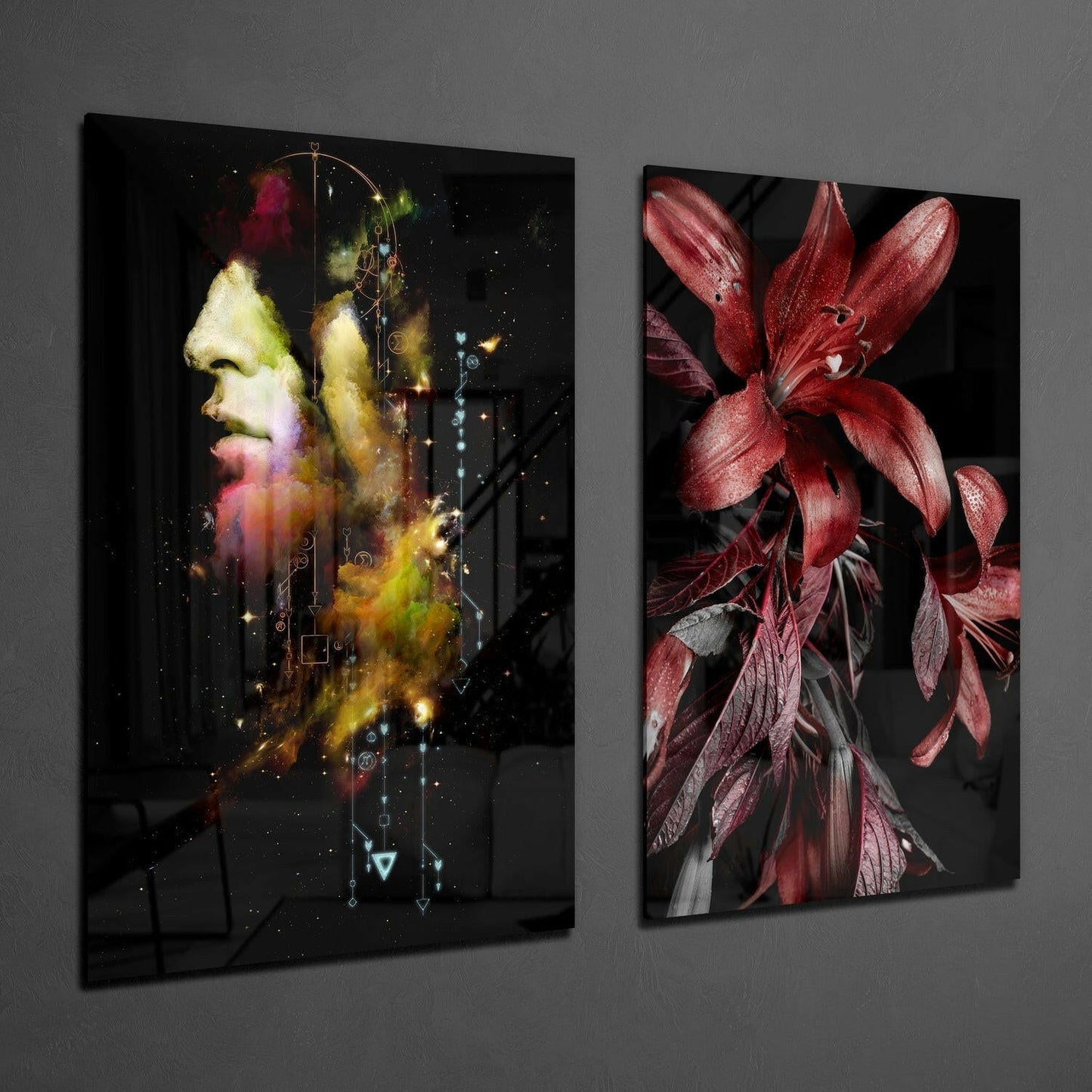 Two glass wall art panels displayed on gray wall: left panel shows colorful profile of man's head with cosmic effects, right panel displays deep red flowers with dark leaves.