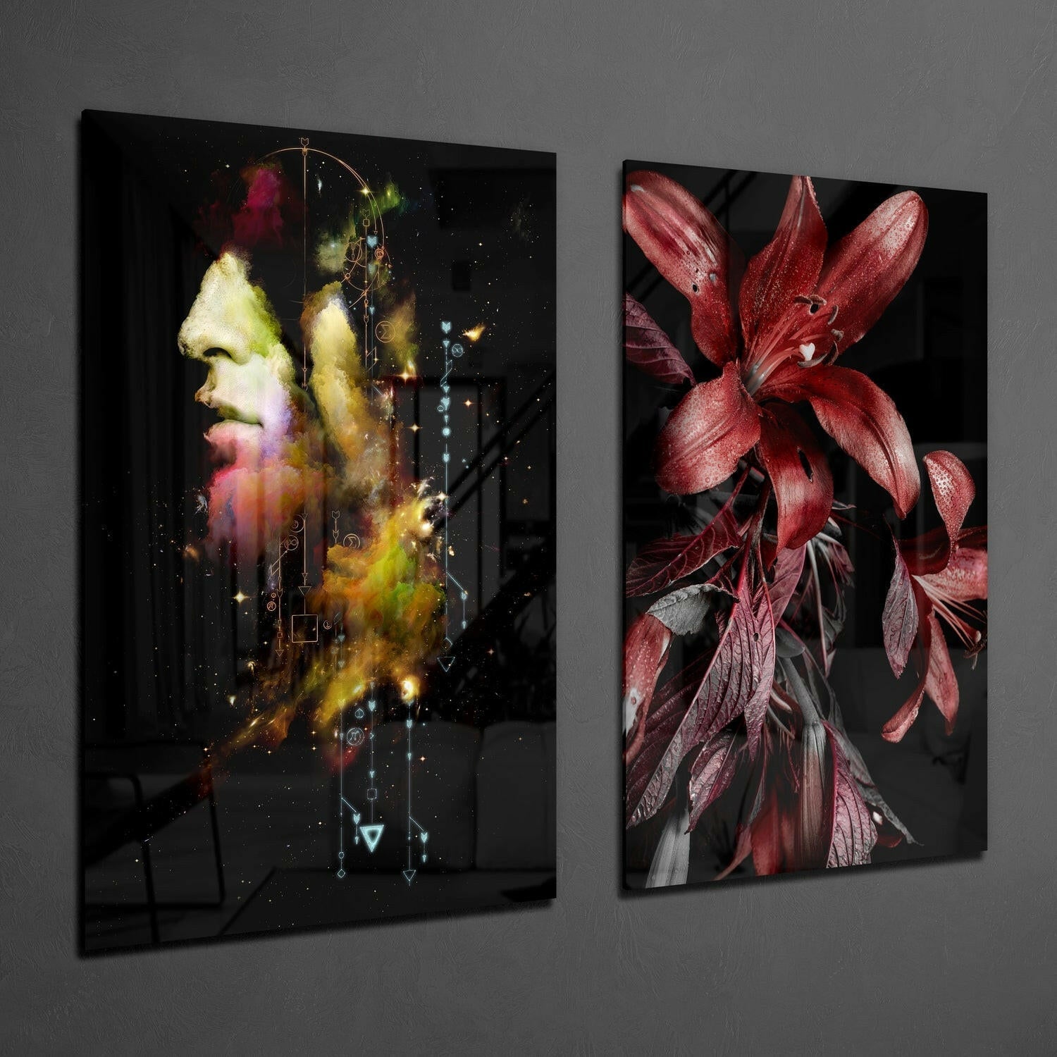Two glass wall art panels displayed on gray wall: left panel shows colorful profile of man's head with cosmic effects, right panel displays deep red flowers with dark leaves.