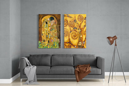 Two gold-toned Gustav Klimt glass artworks hung above a gray sofa in a minimalist living room setting.