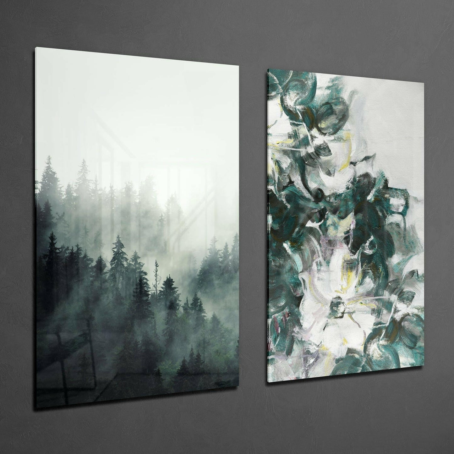 Two framed glass wall panels mounted on gray wall: left panel shows misty forest with evergreen trees, right panel displays abstract green and white brushstroke design.