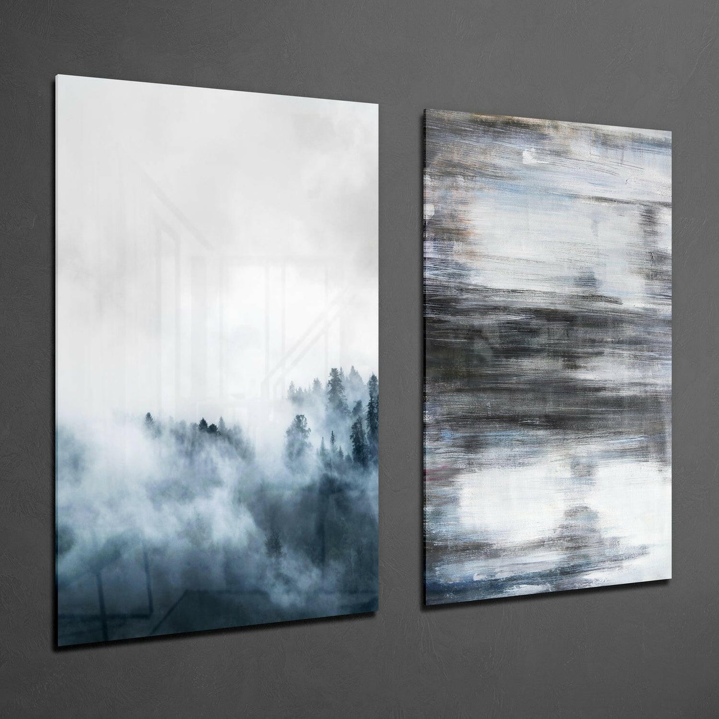 Two framed glass wall panels displaying misty forest and abstract brushstroke designs mounted on gray wall.