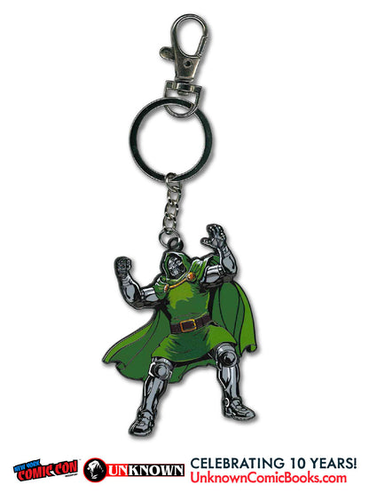 Front view of a metal Doctor Doom keychain with green cape and silver armor, arms raised, and promotional text below.