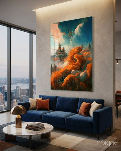 Dream Castle glass art displayed above navy sofa in high-rise living room with orange and teal clouds, cityscape visible through windows.