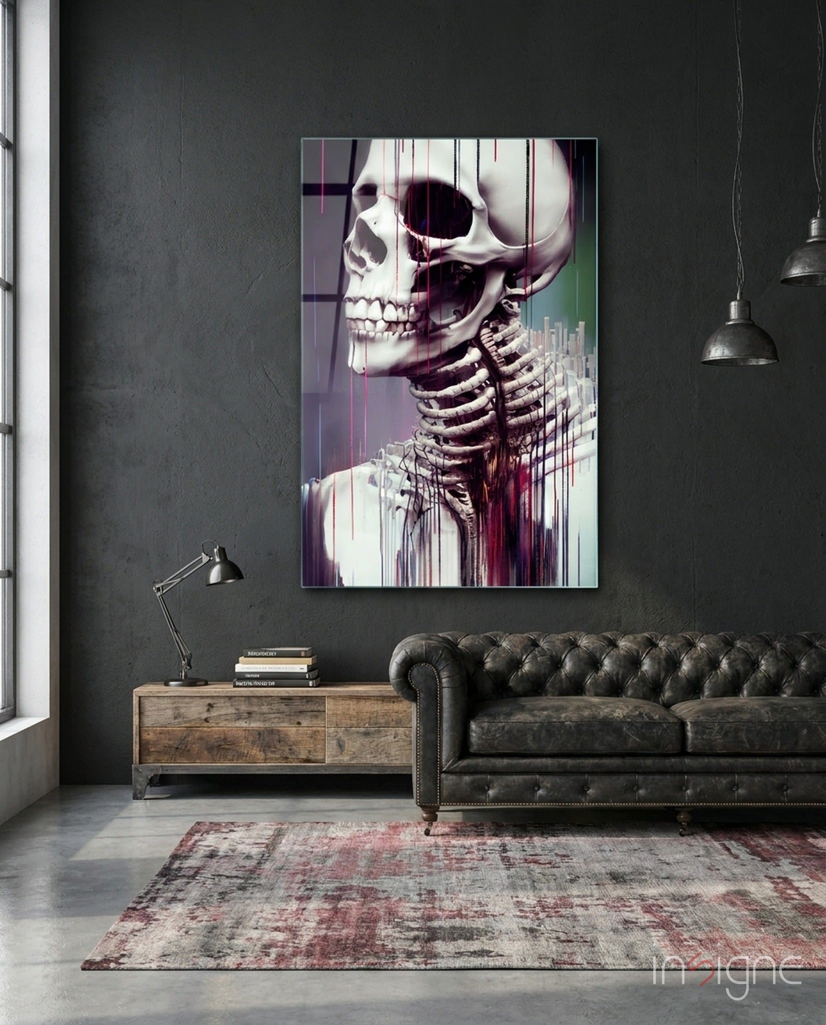 Modern industrial loft interior featuring anatomical skeleton glass art above leather chesterfield sofa with wooden console table.