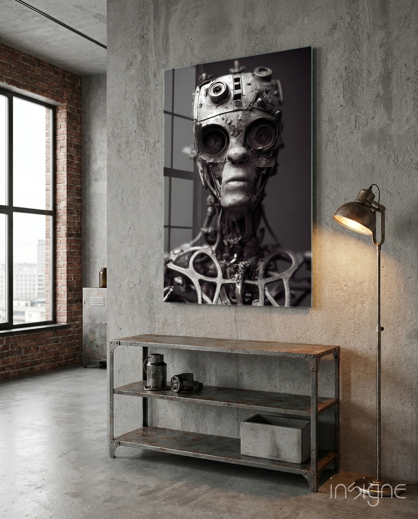 Monochromatic glass art panel depicting a humanoid head with mechanical camera lenses for eyes mounted on concrete wall above industrial shelf.