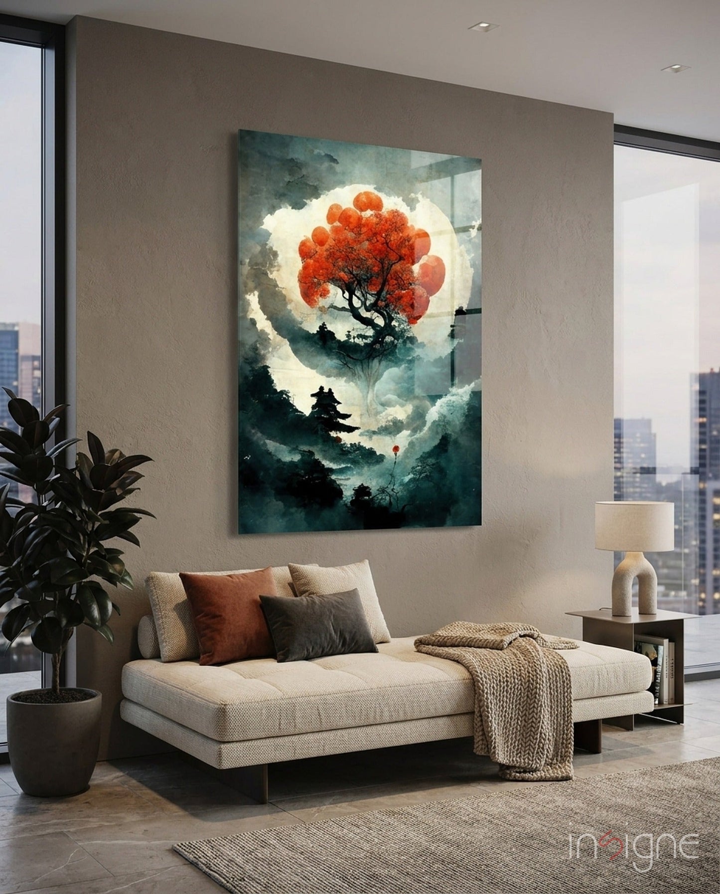 Tree of Life glass art featuring red foliage and silhouetted landscape displayed above cream sofa in modern high-rise interior.