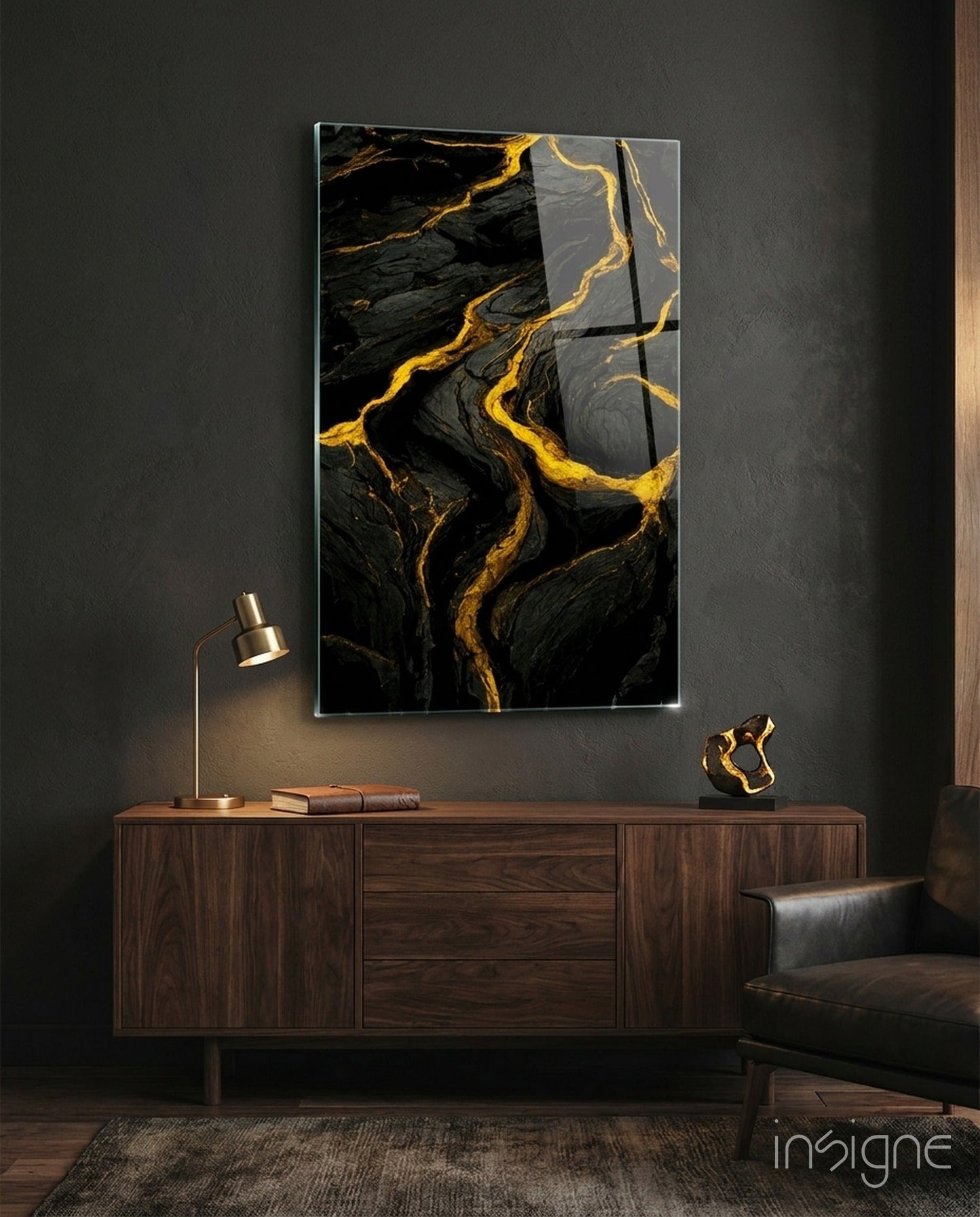 Black and gold marbled slit glass art panel mounted above a wooden credenza in a modern interior setting.